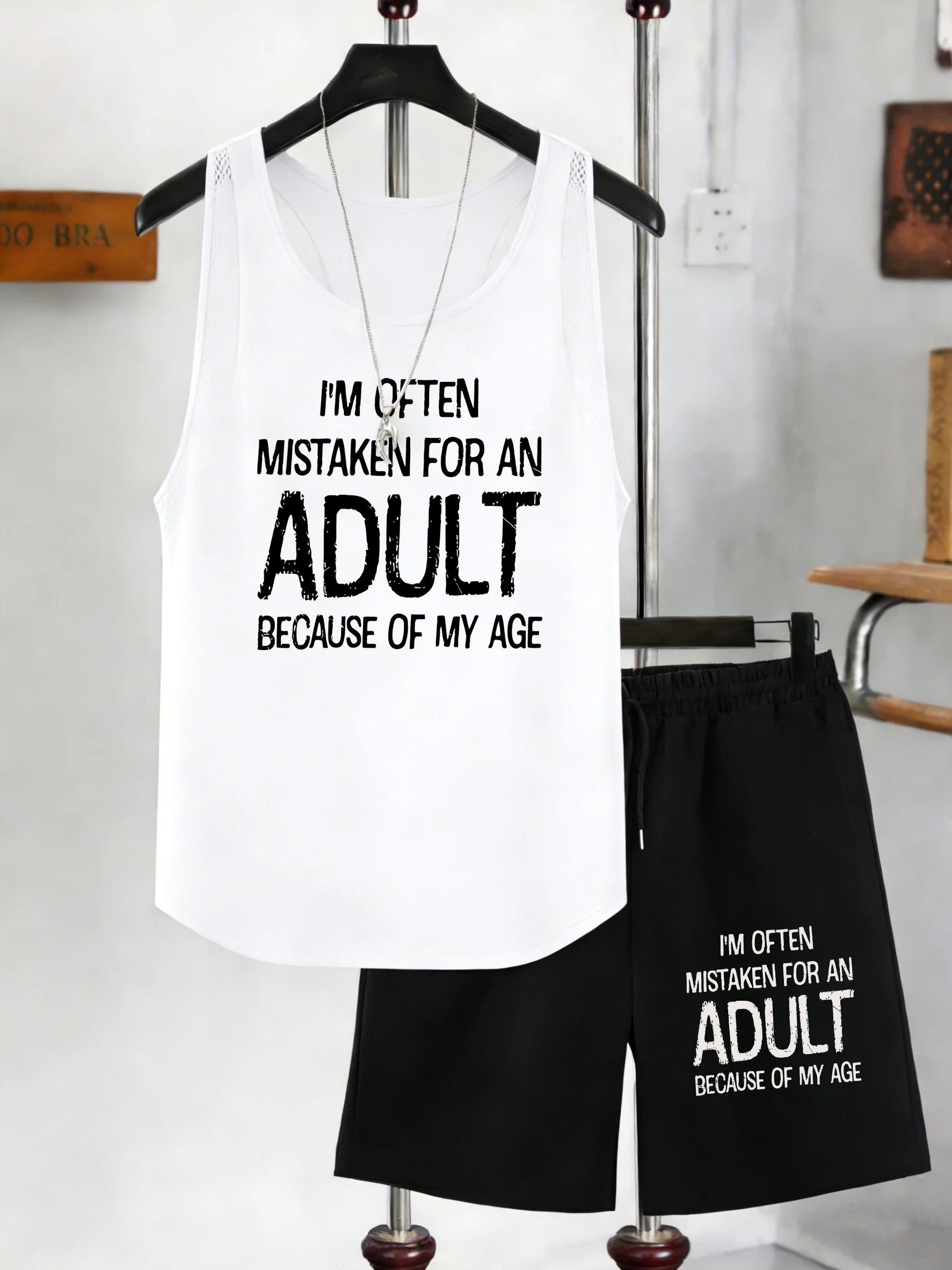 

Мужской комплект: майка с принтом (имитация взрослой одежды) и летние сетчатые шорты с широкими штанинами, карманами и завязками