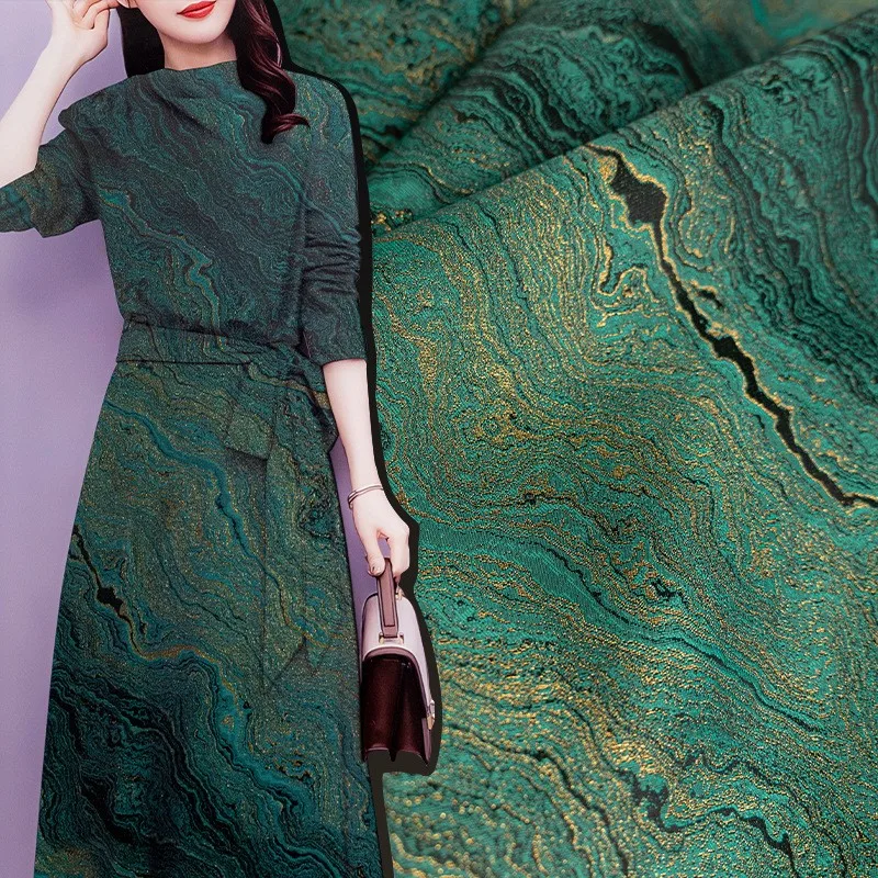 

The designer's fabric for dark green landform jacquard with and gilded cheongsam outer suit skirt pants