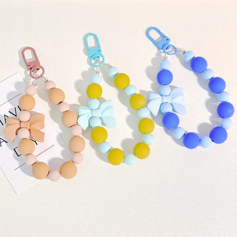 الوردي اللؤلؤ القوس المفاتيح مطرز قلادة مكافحة خسر حبل الهاتف المحمول سلسلة سماعة حقيبة سيارة المفاتيح حقيبة الظهر التبعي