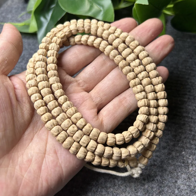 Tibetan-style 108-bead bracelet made of red-skinned agarwood and rosewood , 7mm x 8mm, 120 beads