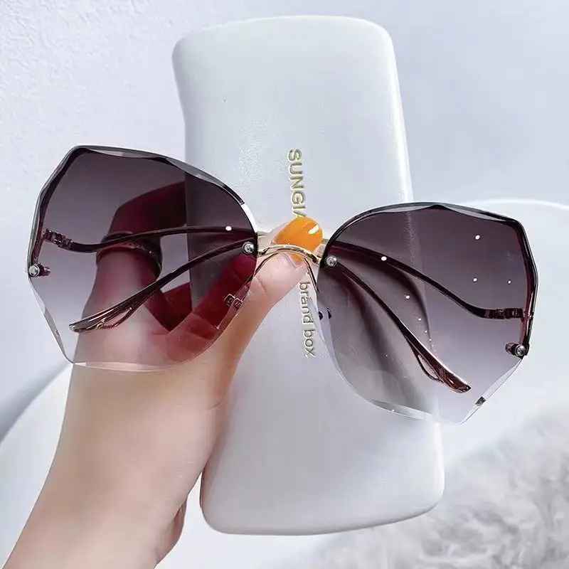 

Fashion Rimless Sunglasses Women Men Brand Design Retro Cutting Lens Metal Curved Temples Gradient Vintage Sun Glasses Female