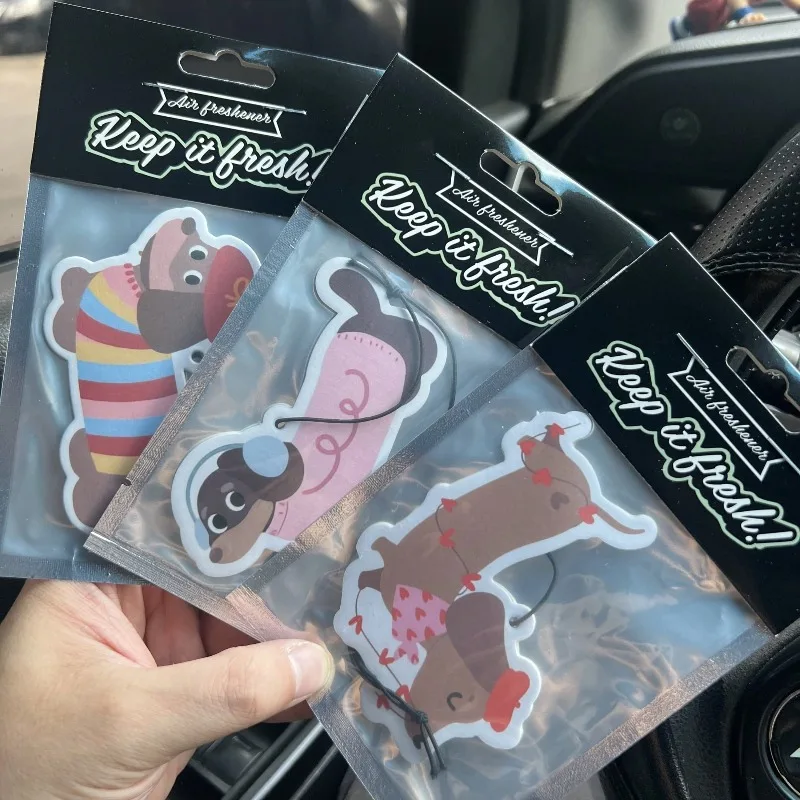 Cute dachshund car air freshener — couple styles available. Cartoon/anime design, perfect for rearview mirrors, Creative and fun