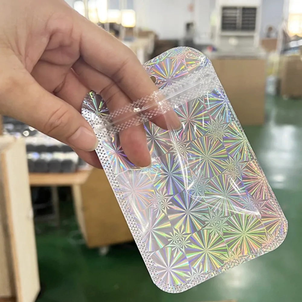 Bolsa de embalaje holográfica para almacenamiento de joyas, autosellante con láser de plata de 50 piezas, para pequeñas empresas