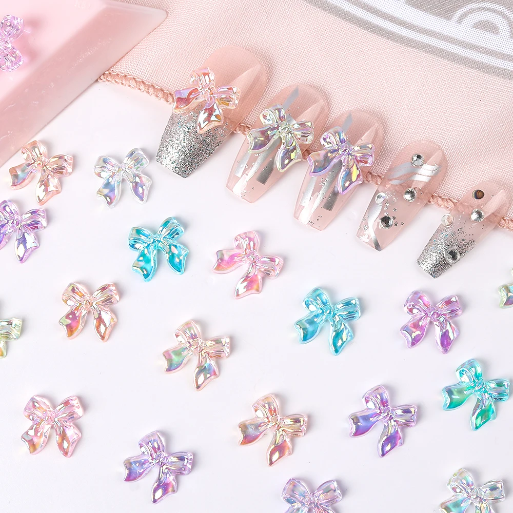 100 sztuk AB 3D wstążka z żywicy kokardy Nail Art Charms Bowtie dżetów Nail Art Decor biżuteria akcesoria dekoracyjne proporczyk