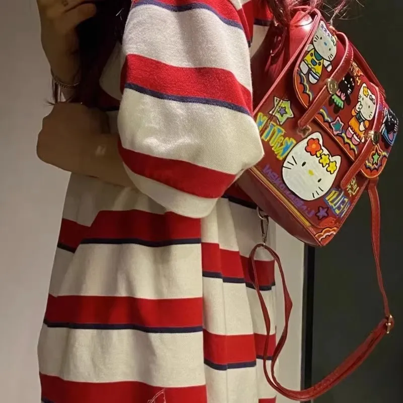 MINISO-mochila con grafiti de Hello Kitty, bolso escolar bonito para estudiantes de secundaria y secundaria, novedad de 2024