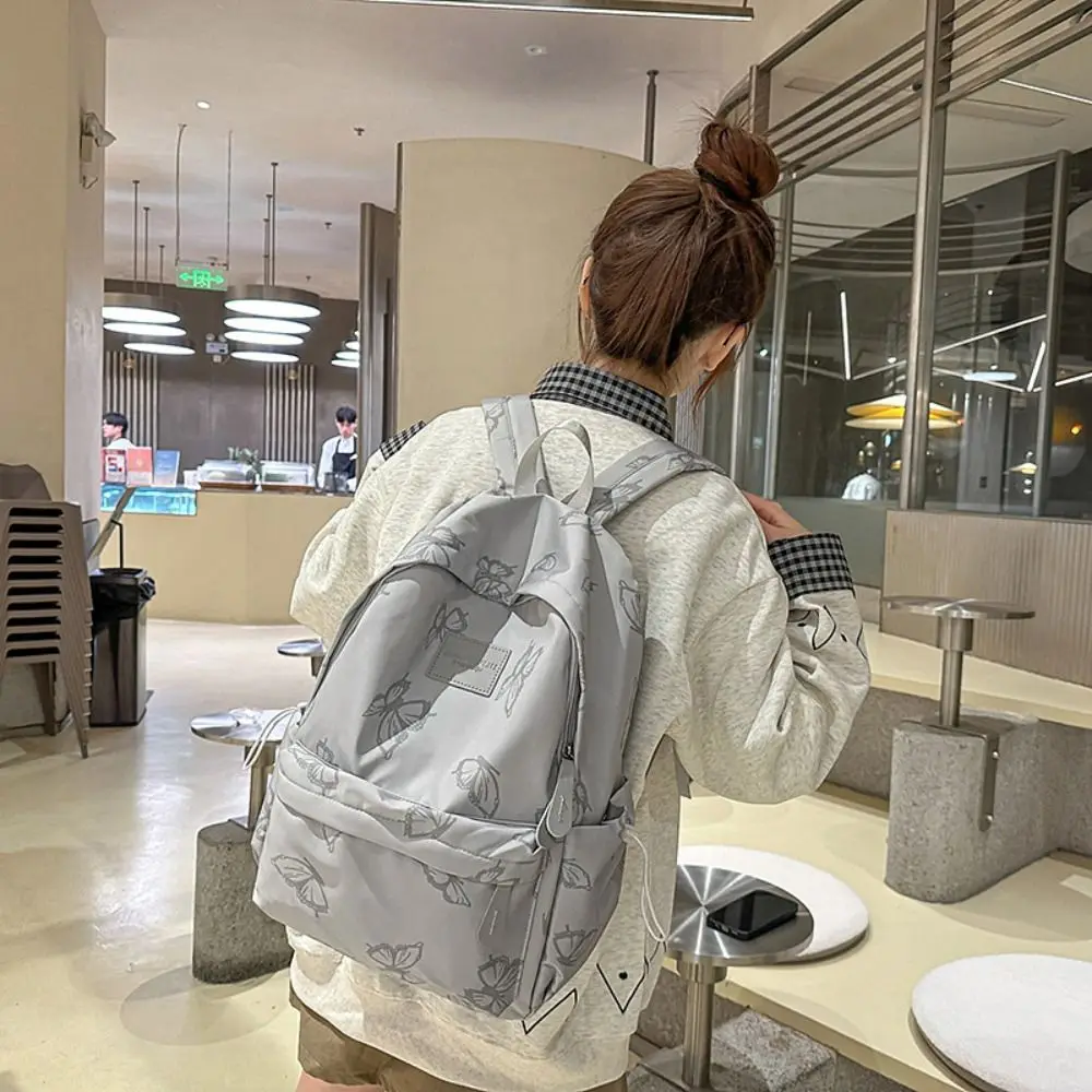 حقيبة ظهر صغيرة مقاومة للماء على شكل فراشة على الطراز الكوري بلون سادة وسحاب حقيبة كتف للياقة البدنية حقيبة يد كاجوال على الظهر في الهواء الطلق