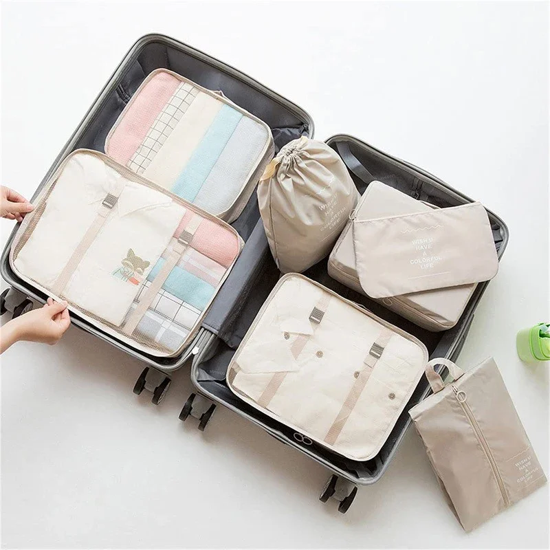 

A 7-piece travel packing bag set, including a blanket, clothes, shoes, underwear, cosmetics, a toiletry bag and a travel suitcas