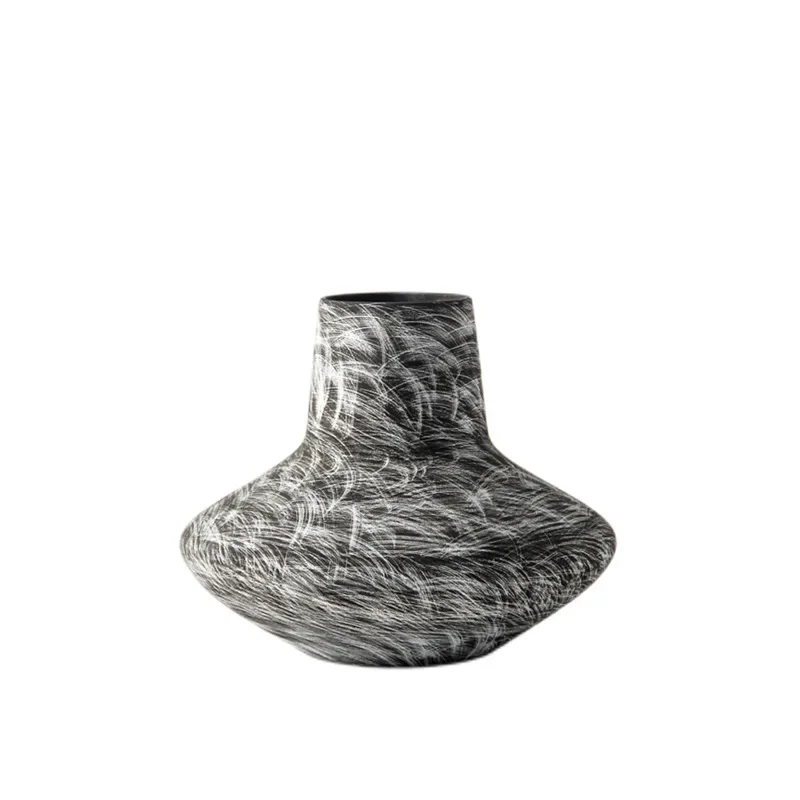 

Handmade black and white ceramic flower ware