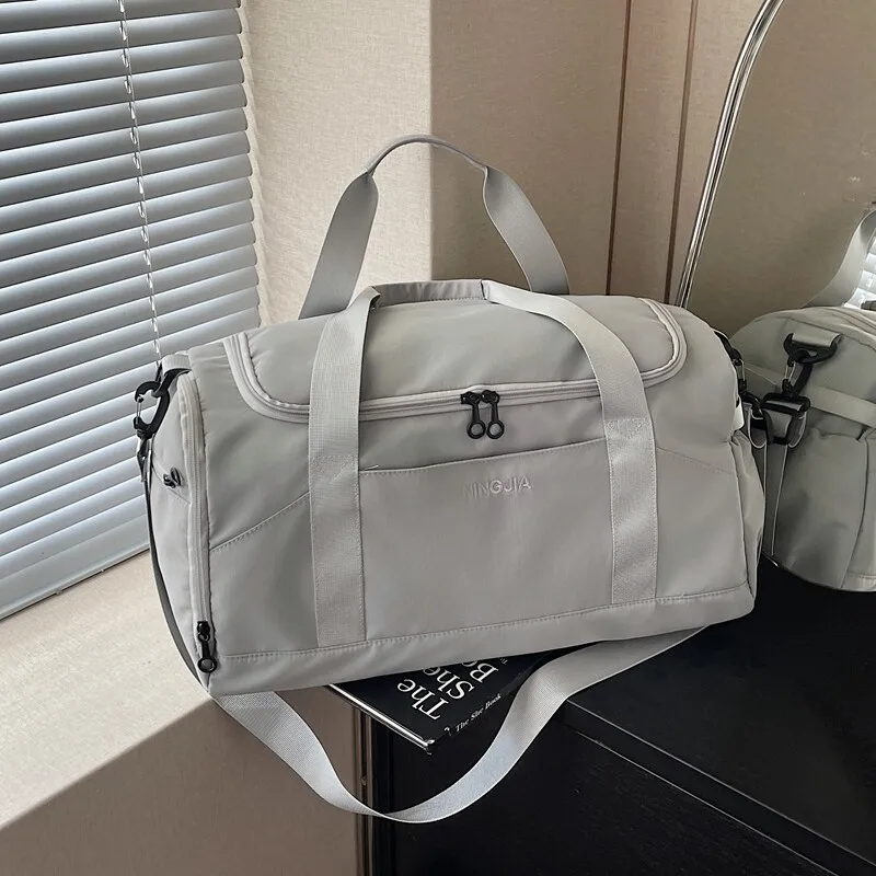large-capacity-travel-bag-women's-handheld-luggage-waterproof-dry-wet-separation-airport-check-in-bag-lightweight-backpack-style