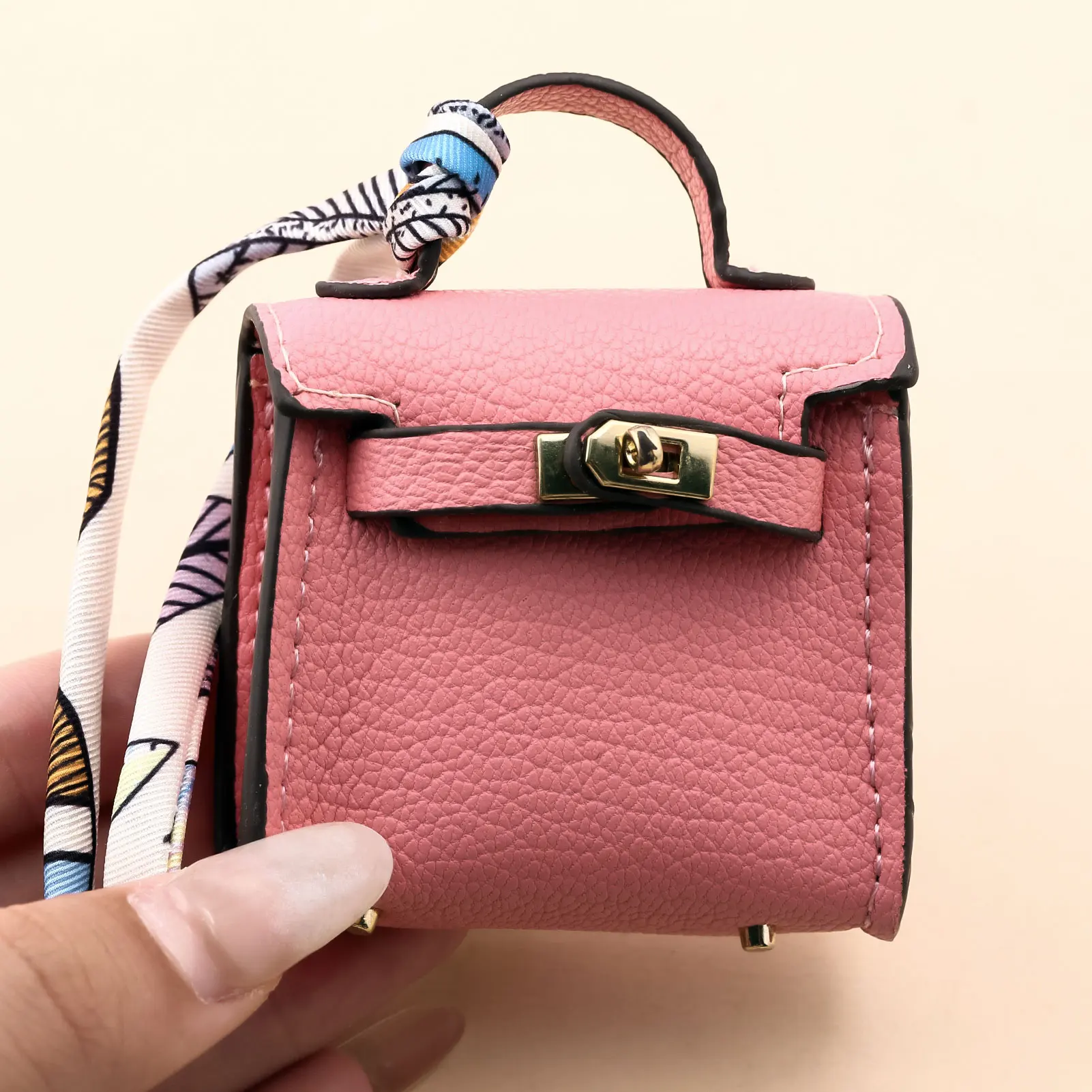 حقيبة صغيرة كيلي لأحمر الشفاه حقيبة سماعة الرأس حقيبة لطيفة شريط معلق حقيبة سلسلة مفاتيح ساحرة للنساء بلون سادة حقيبة أنيقة ملحقات هدية