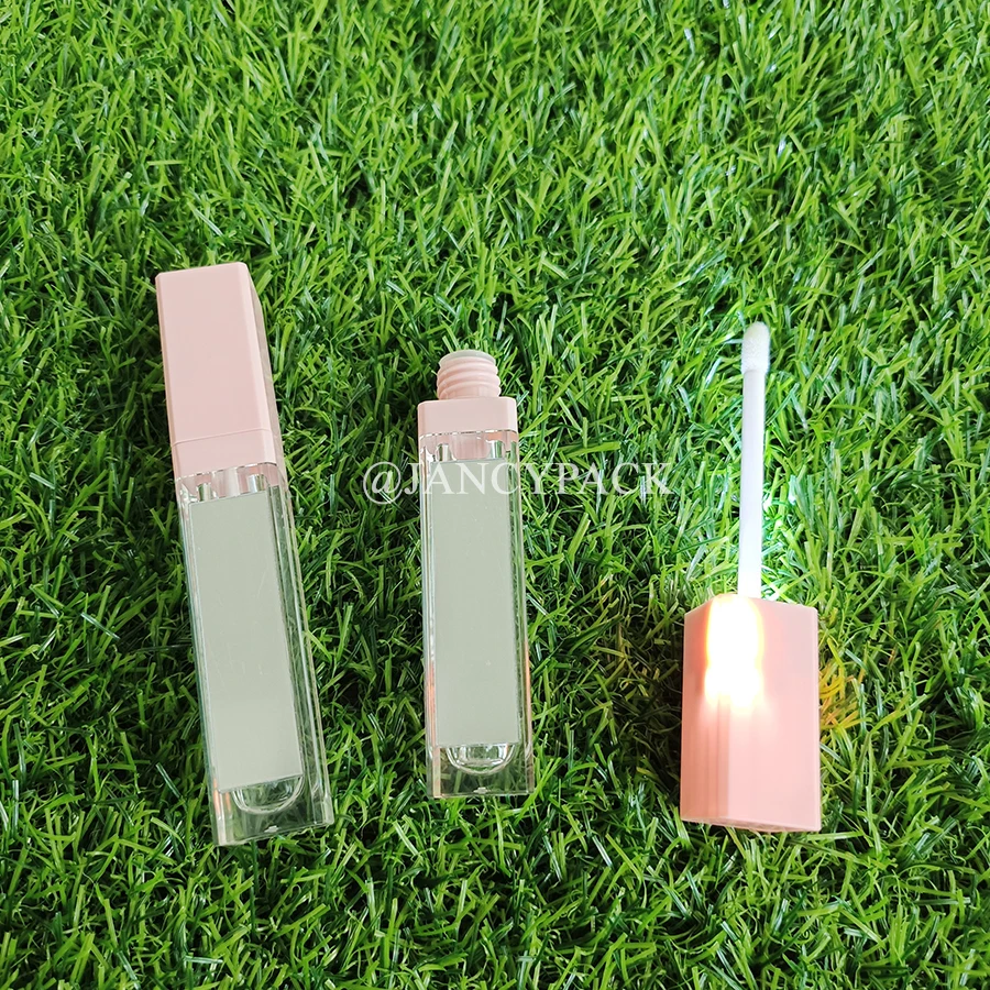 หลอดลิปกลอสใสขนาด 7 มล. สีดำชมพู พร้อมไฟ LED น่ารัก แบบ Private Label พร้อมแท่งทาสีทองเงินและกระจก