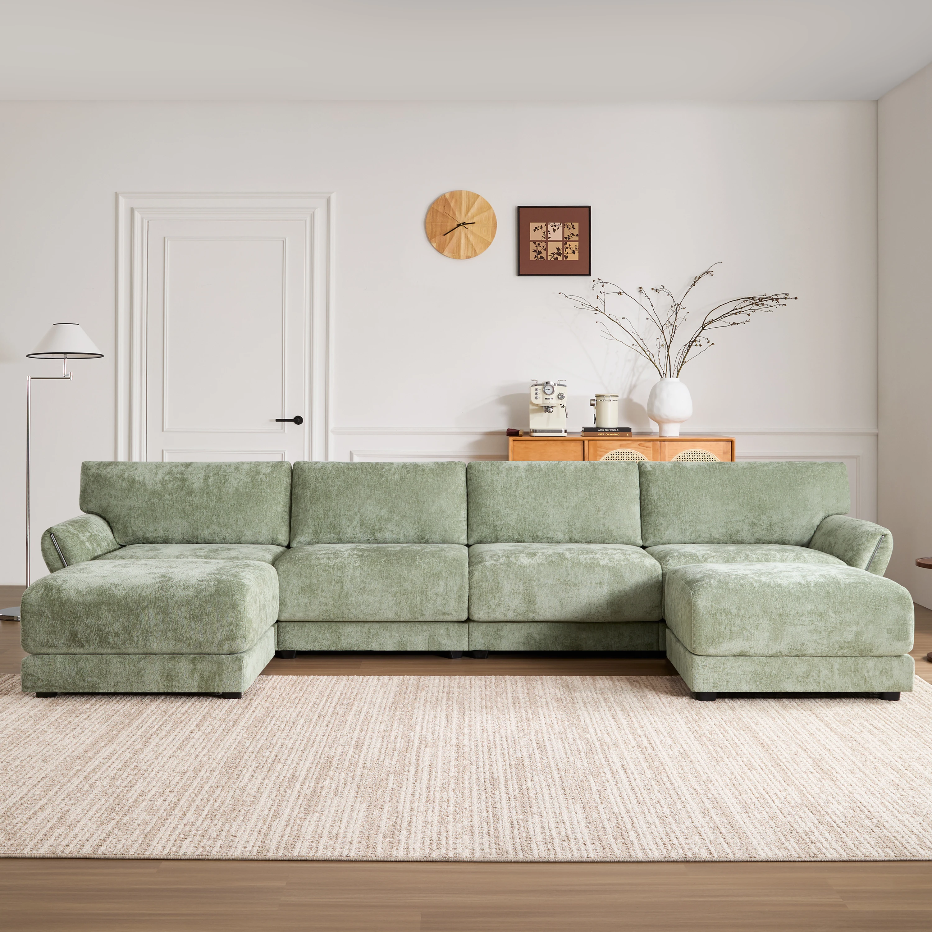 Modular sectional sofa with petal-shaped armrests, a freely movable ottoman, and built-in charging—no extra power board required