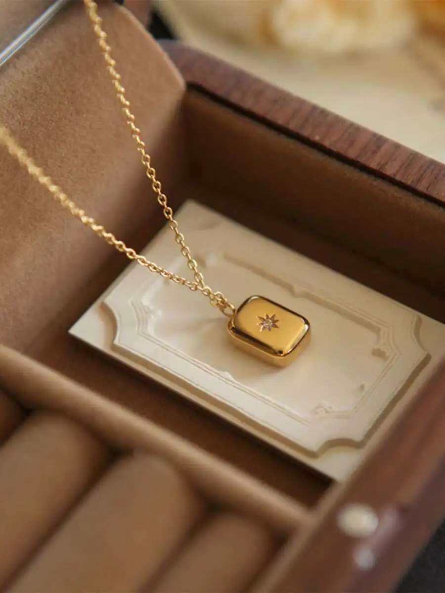 

Gold-Tone Rectangular Pendant Necklace with Star Motif on Chain