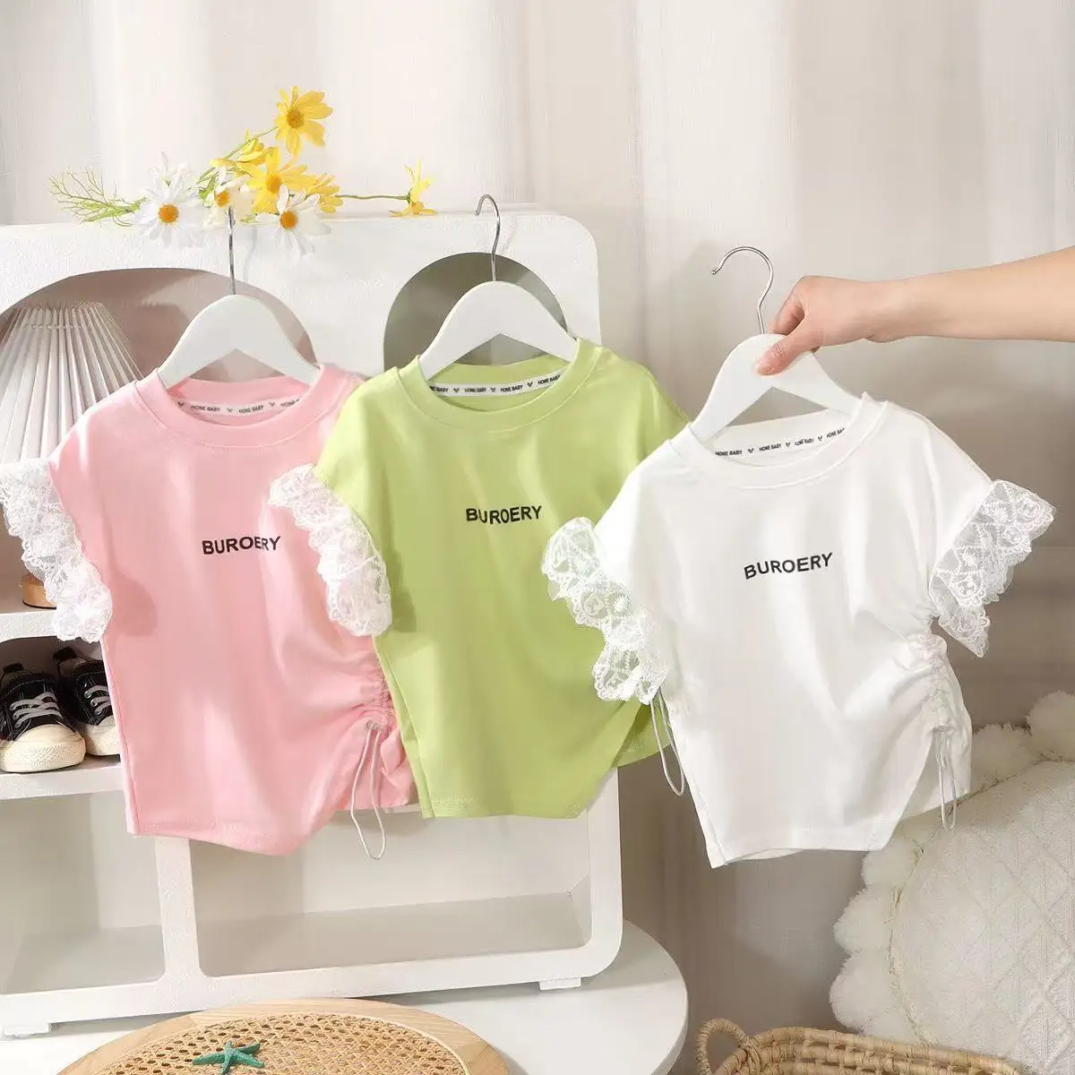 

2025 Summer New Girls' Short Sleeved T-shirt Children's Fashion Drawstring Hollow Lace Lace Lace Versatile Top