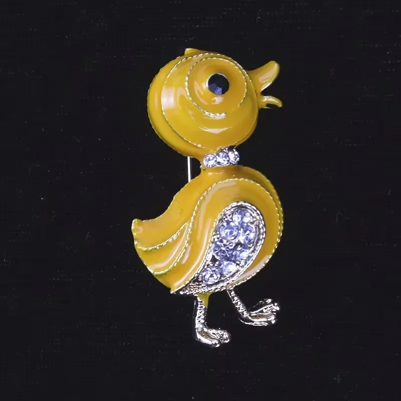 Elegant crystal yellow duck pins - a captivating accessory, shining brightly, and a perfect gift for fashion enthusiasts