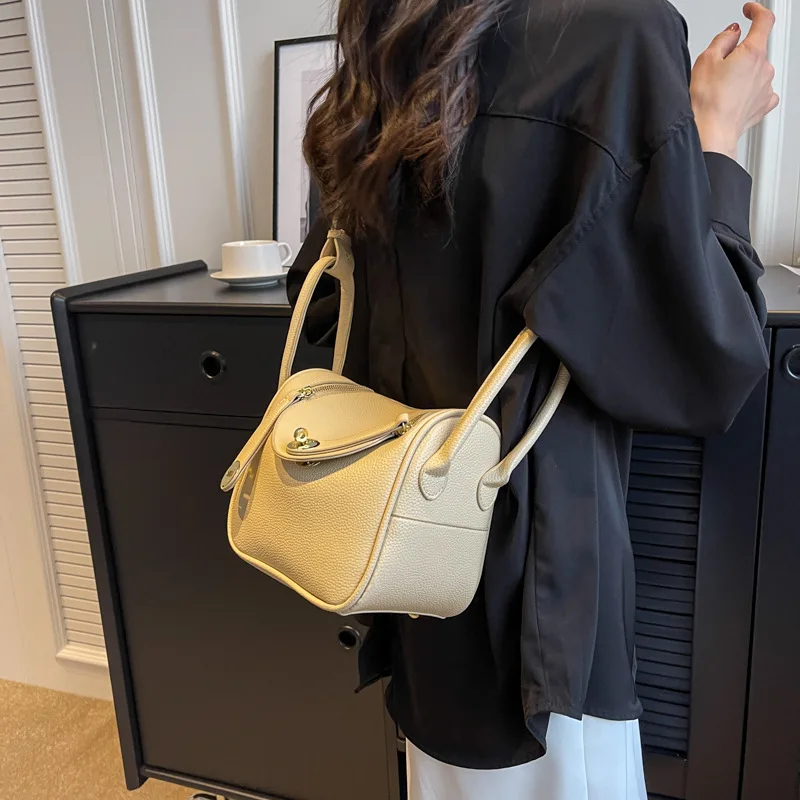 

Fashion sense of high quality lychee style ladies double pull handheld commuting shoulder diagonal straddle hundred women's bags