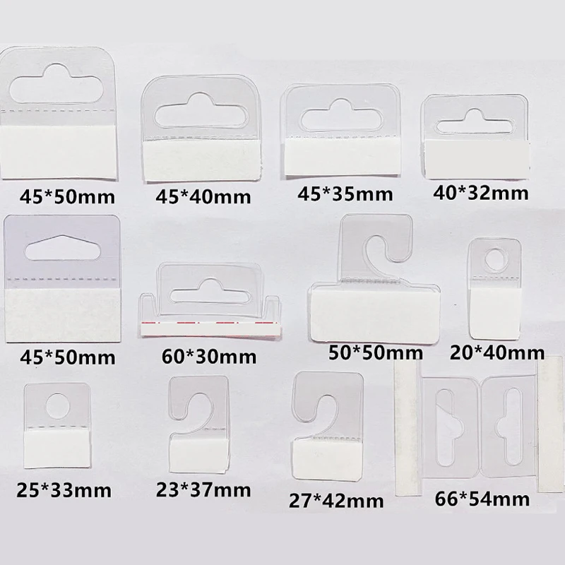 100pcs PVC Slot Hole Adhesive Hang Tabs Hook Plastic Transparent Hook Merchandise Package Box Bag Hangers Peghooks Display