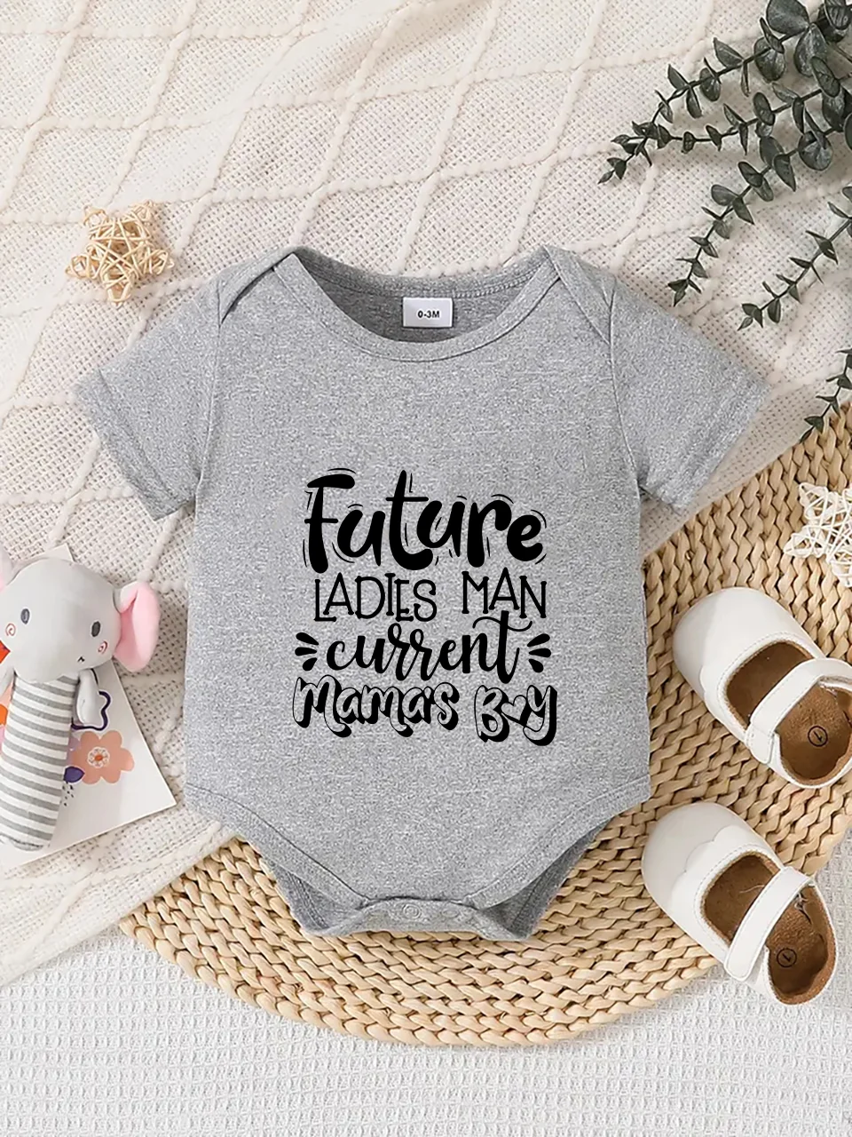 Playful letter-printed baby short-sleeve triangle bodysuit. Button closure for easy dressing