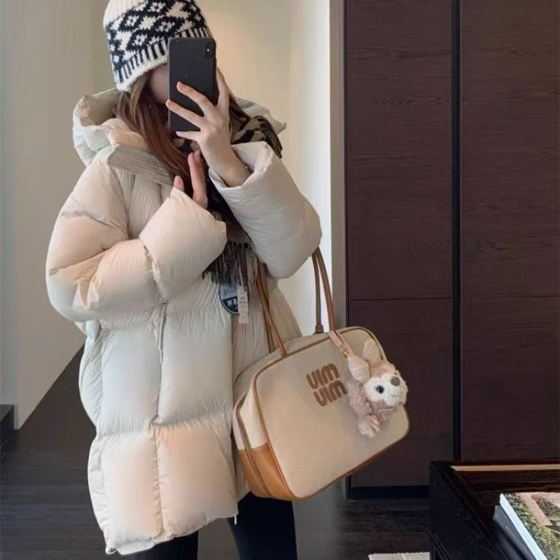 Autunno Inverno Giacca di cotone medio-lunga Donna 2025 Cappotto di cotone con cappuccio casual allentato di nuova moda Addensare tuta sportiva rosa femminile