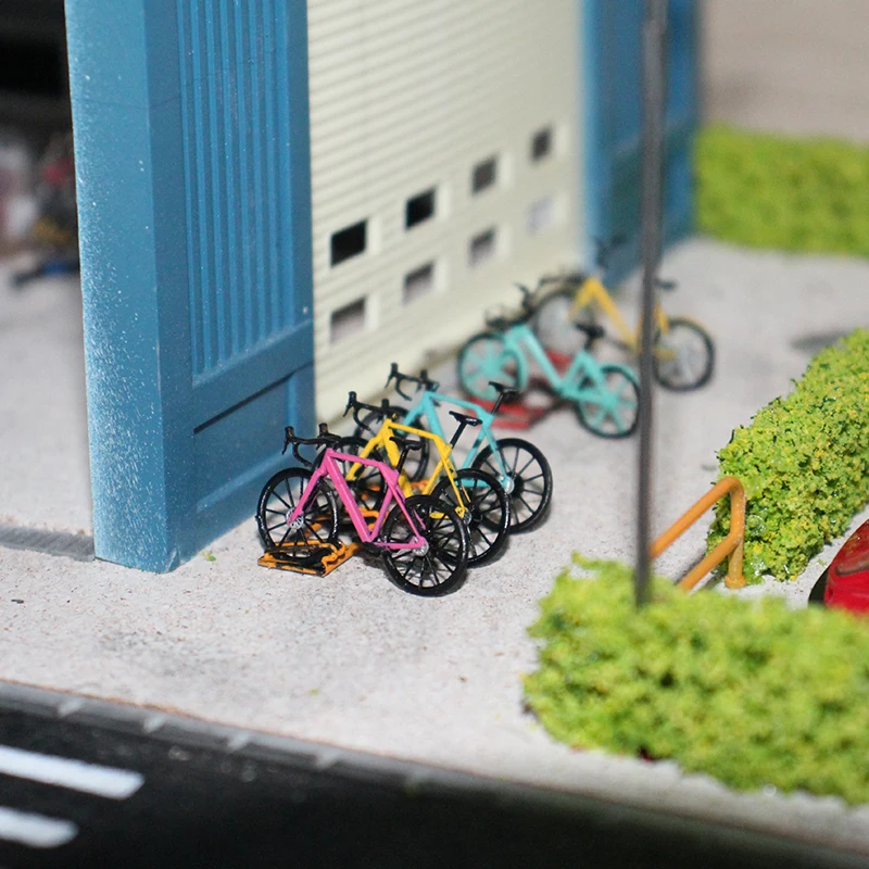 Model roweru w skali 1:64, rower szosowy, model roweru publicznego, model stojaka na rowery.