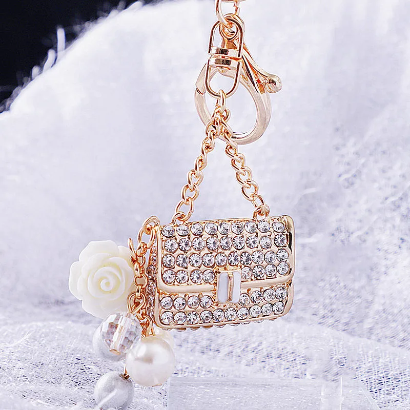 Pearl small fragrance small satchel keychain Women's bag pendant metal keychain ring diamond keychain.