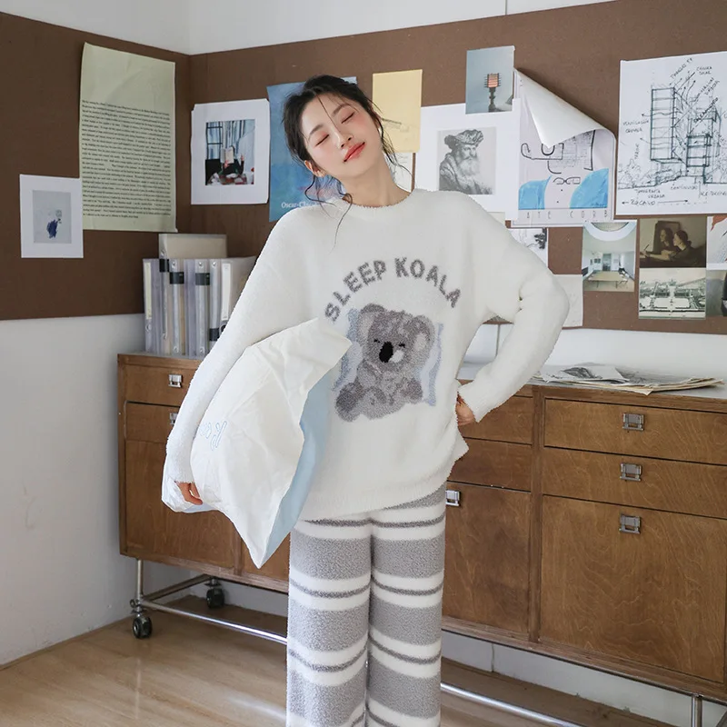 Soft and cozy women's winter pajamas, featuring a koala design, English-style striped pants, color-blocked pullover, and a thick