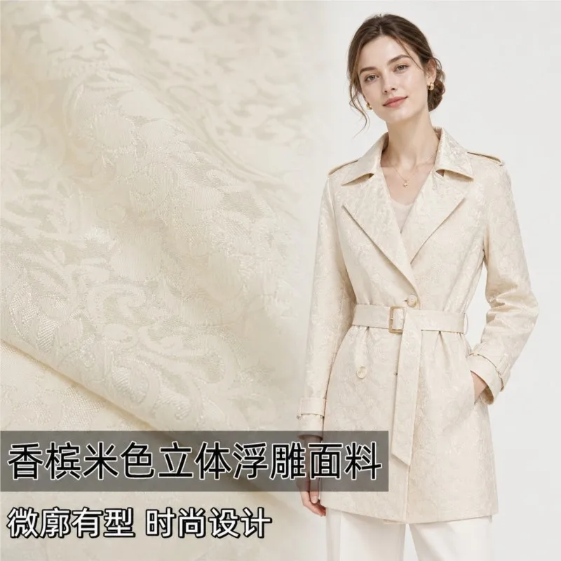 The designer fabric for coat windbreaker pants and dress in penang beige with a subtle jacquard pattern slight luster