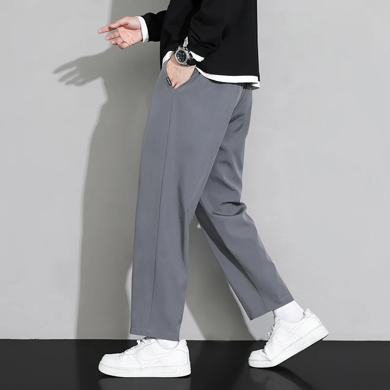 Pantaloni comodi da uomo alla moda con coulisse e elastico in vita, design in tinta unita, adatti per l'abbigliamento primaverile e autunnale