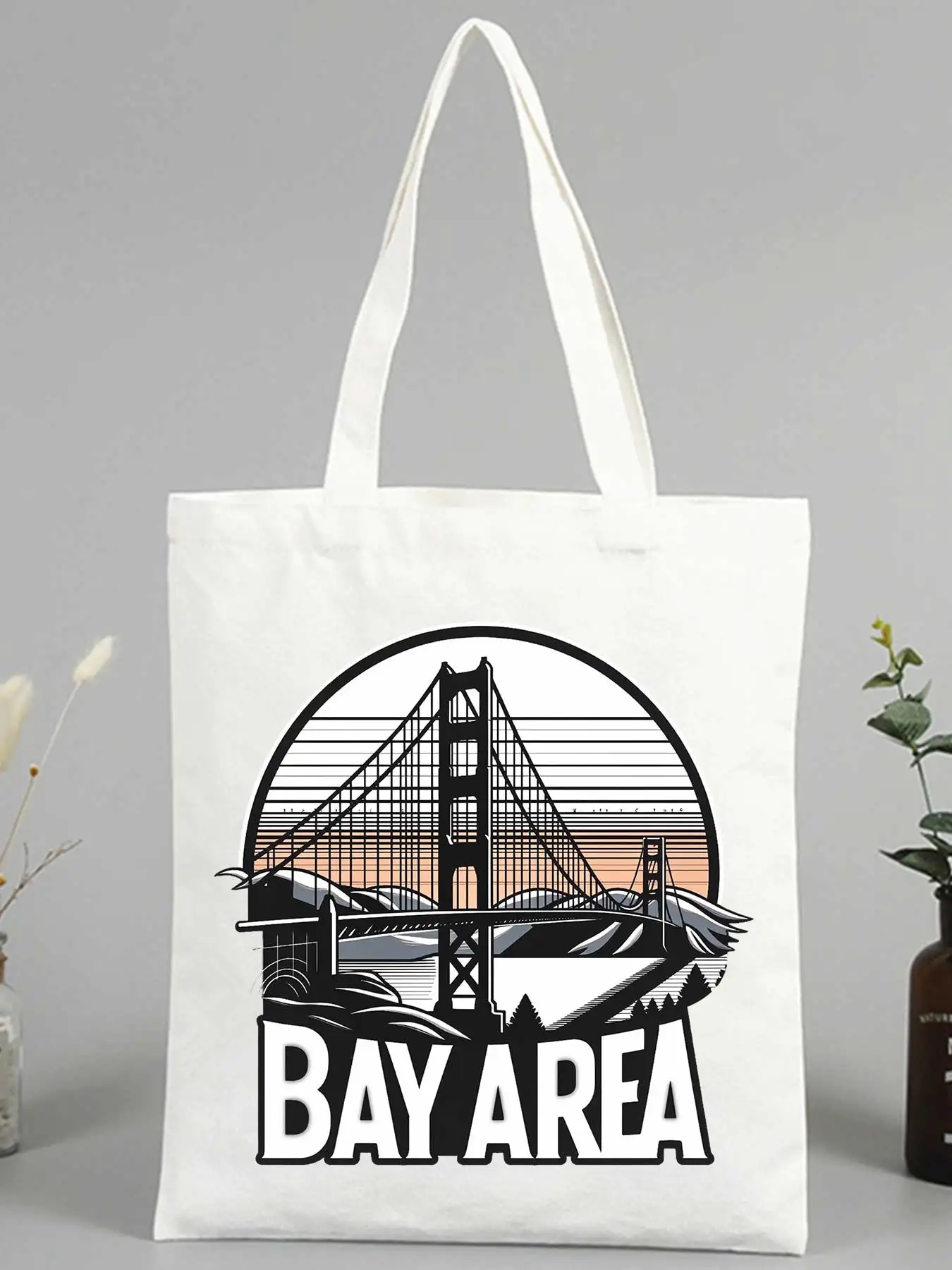 Women's canvas tote bag with bridge and sunset graphic, retro style for casual shopping and daily use