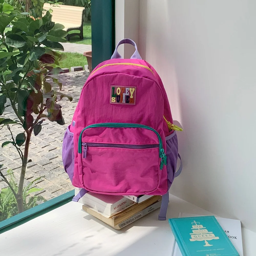 

2026 New Contrast Color Pactwork Lightweight Casual Backpack Daily Leisure Large Capacity Outdoor Nylon Sports Backpack