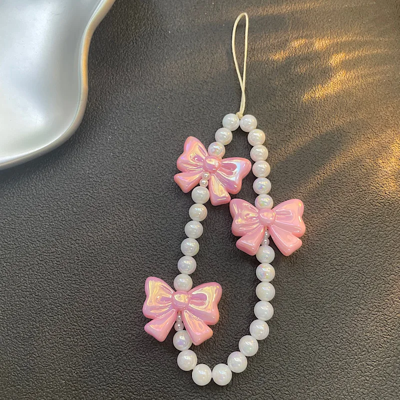 Cadena de teléfono de diseño original |   Cadena rosada del teléfono del arco de la perla, cadena CCD del teléfono del grano de la muchacha para el encanto lindo del teléfono del iPhone 17 16