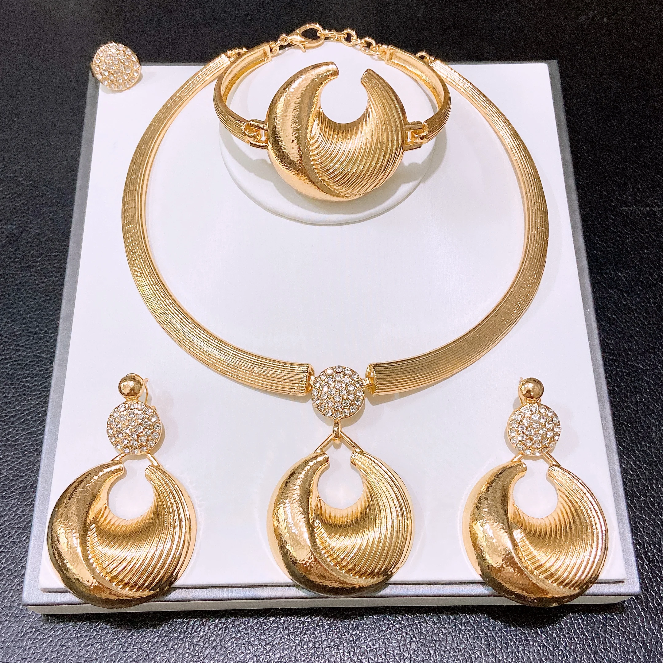 

Yulaili Gold Plated Textured Geometric Curved CZ Stone Jewelry Set Necklace Bracelet Earrings Ring Women Party Wedding HB013