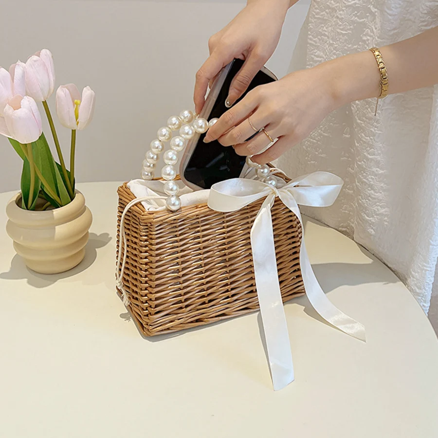 Summer new rattan straw woven handbag hand-woven hollow out pearl handle clutch fresh beach vacation travel photo bags for women