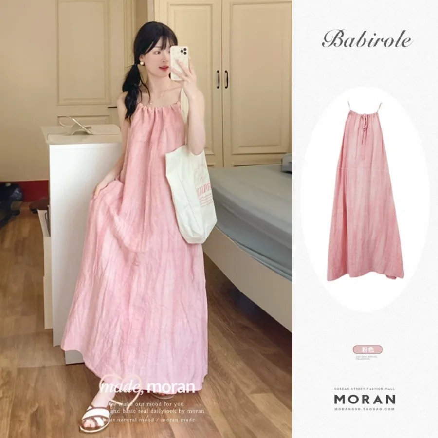

【New style】Pink suspender long dress women's summer new seaside vacation beach dress hanging neck design niche skirt