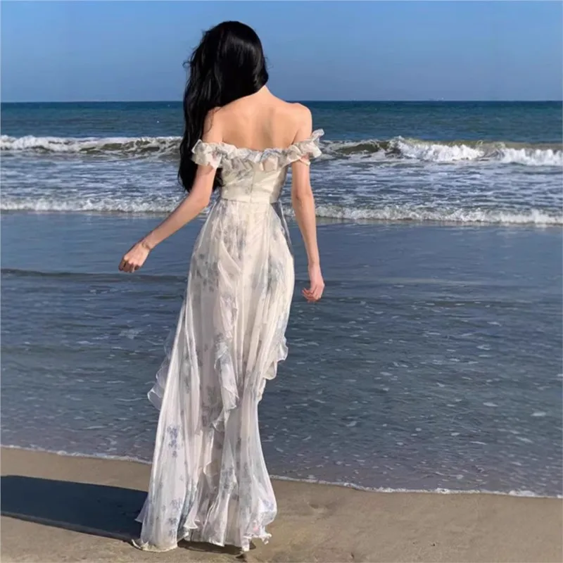 Off-the-shoulder beach dress with a French ruffle hem, a flowing fairy-style dress with a seaside holiday vibe.