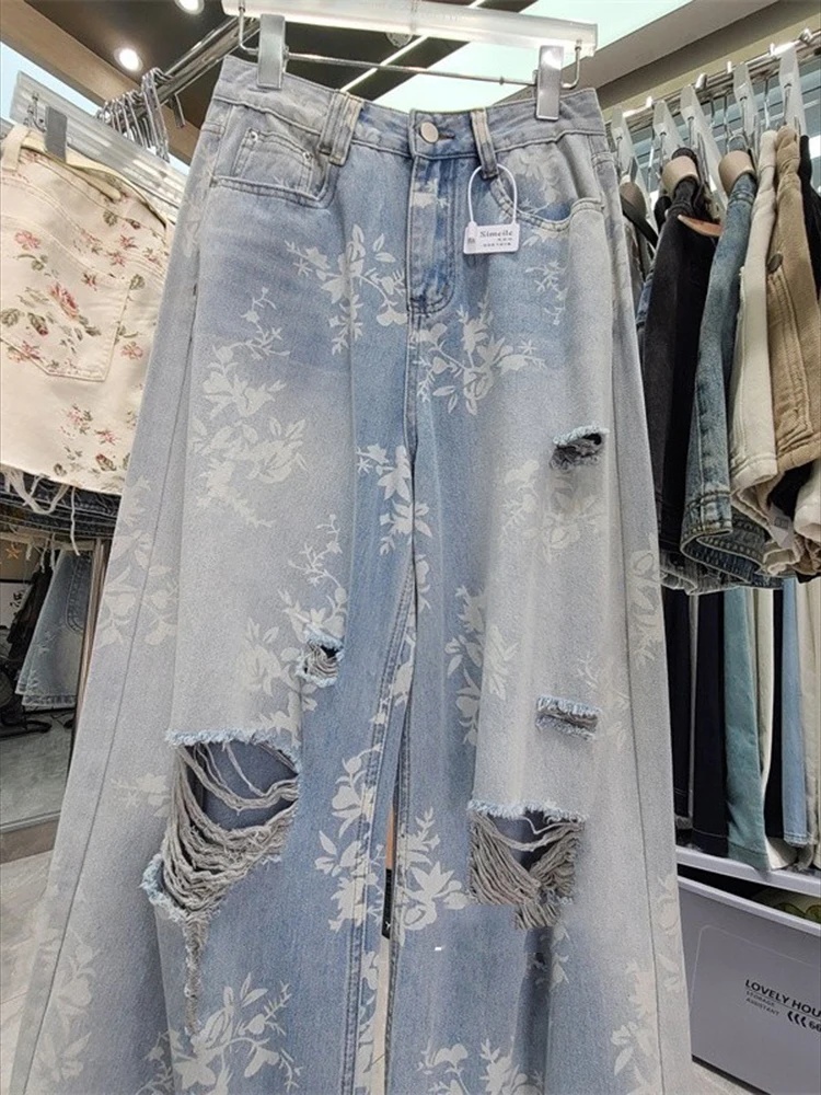 Novedad de verano para mujer, pantalones de suelo a la moda y con estilo, pantalones vaqueros de pierna ancha rasgados con estampado floral retro de estilo americano