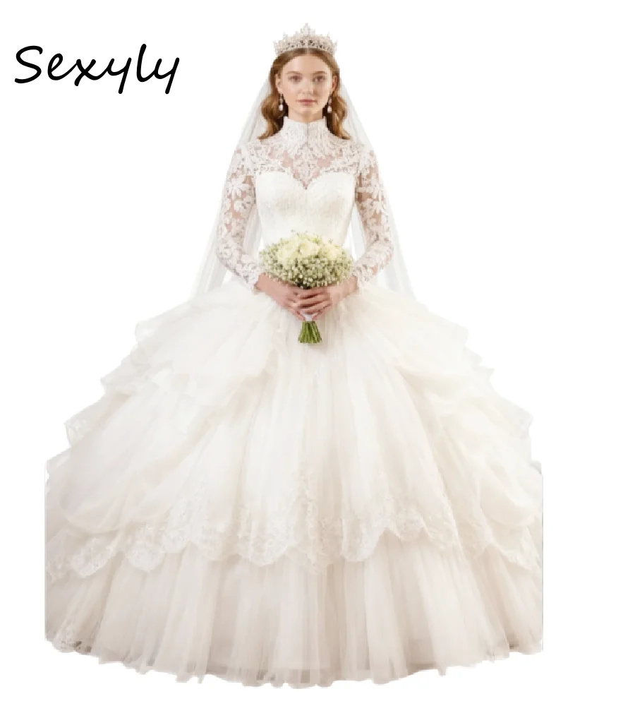 ชุดแต่งงานเจ้าหญิงสไตล์เกาหลีแบบกัตสบี้ ผ้าลูกไม้ แขนยาว ทรงบอลกาวน์ คอสูง ชุดเจ้าสาวราชินี ปี 2026 สไตล์โบโฮอีเทอร์เรียล สง่างาม