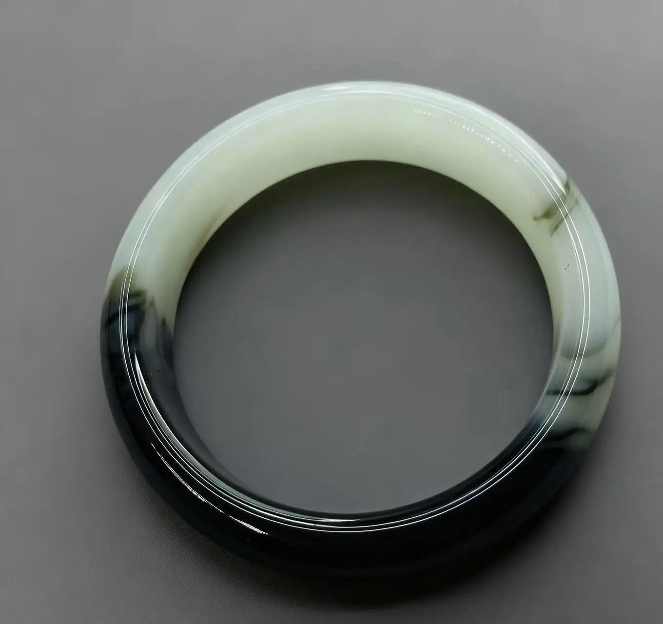 

Real shooting natural Hotan Jade black white 58.2mm bracelet