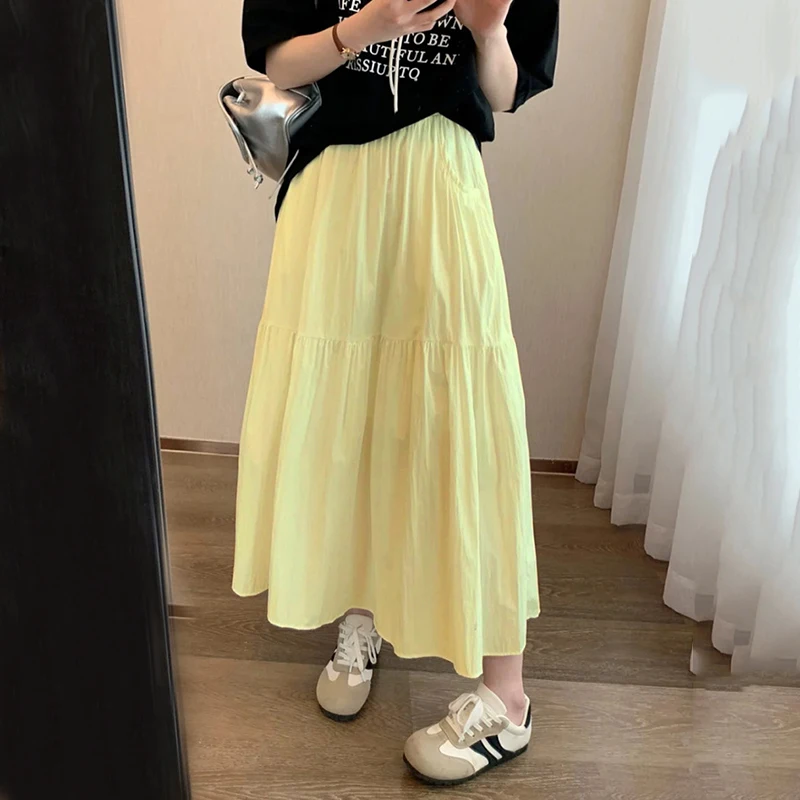 2025 Estate Bianco A Line Gonna Donna Moda coreana Elastico in vita Gonna lunga a pieghe Donna Tasca tinta unita Gonne medie Feamle