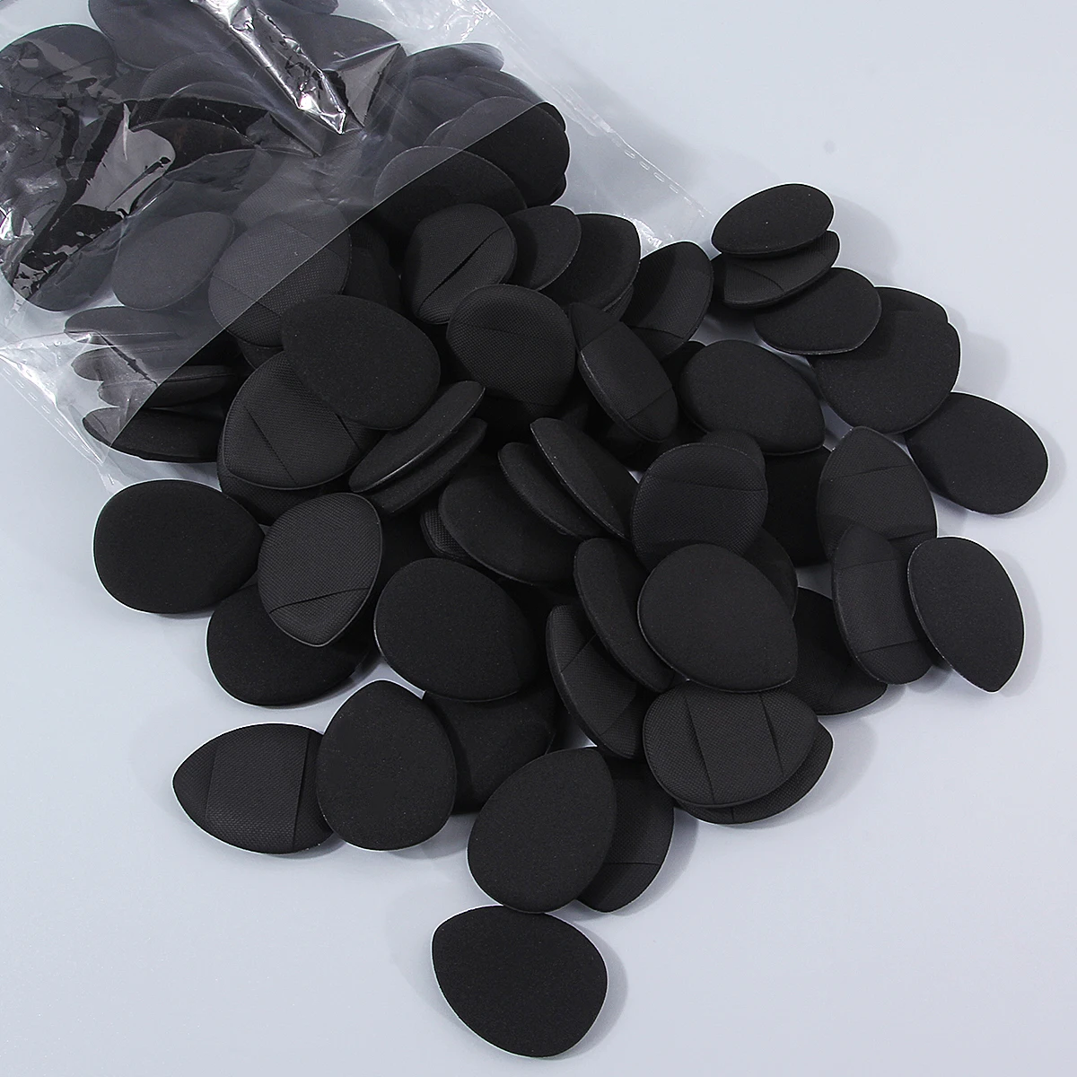 100PCS Super affordable and portable makeup thumb set, teardrop-shaped dry and wet dual-purpose non-stick mini powder puff