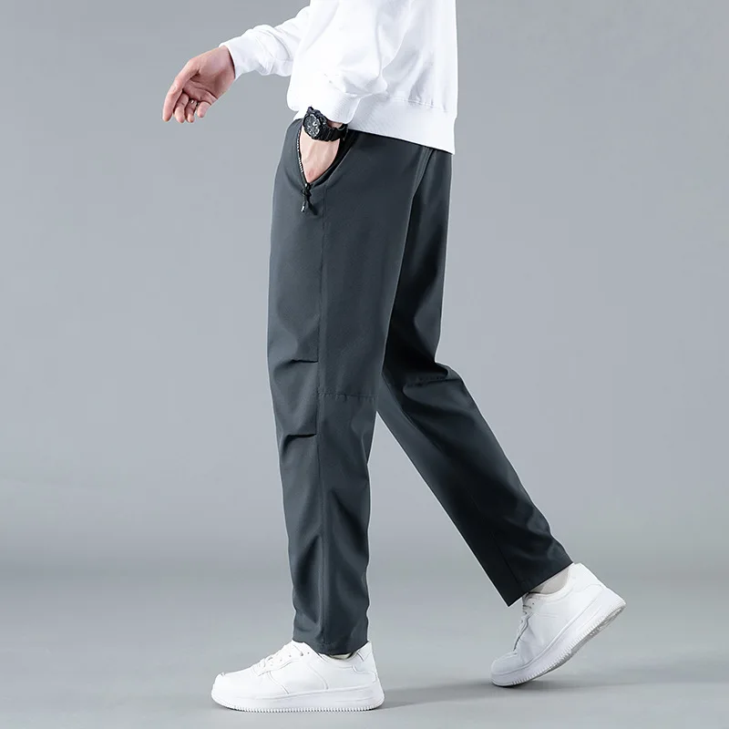 

2025 Autumn New Sweatpants Men Pockets Drawstring High Elasticity Casual Track Pant Male Loose Straight Trousers Large Size