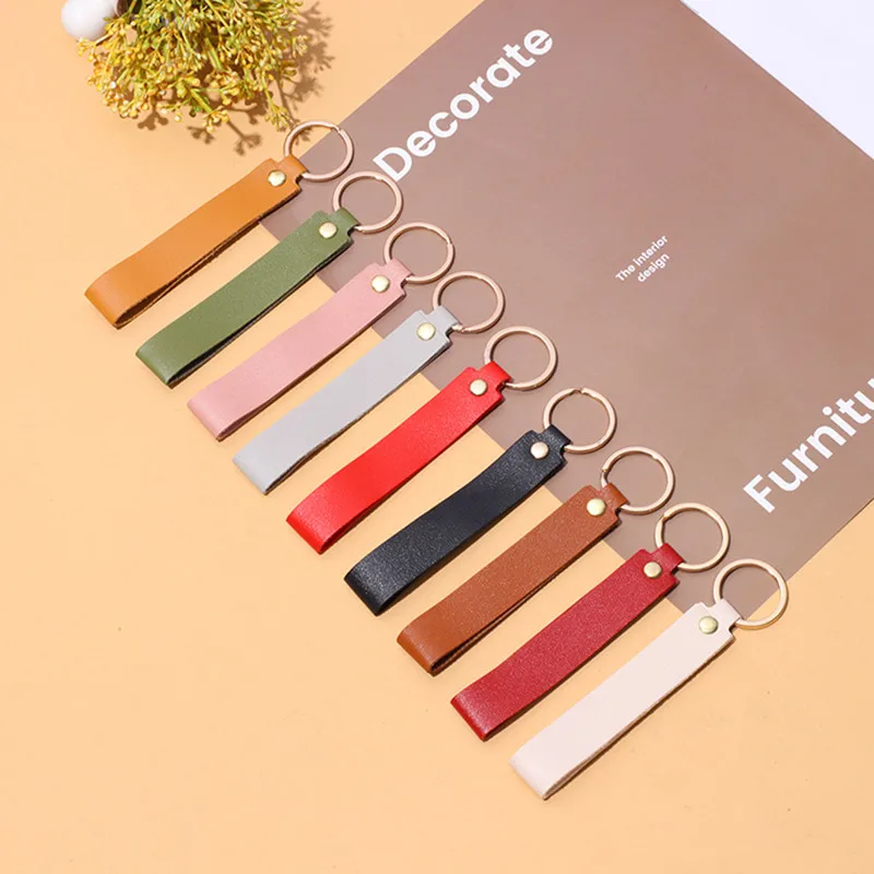 Versatile Solid Leather Key Buckle Handle rope bag Pendant Doll Portable strap Fashionable Couple car Keychain Accessories