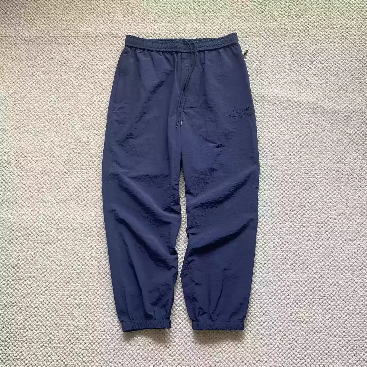 The Ennoy Professiona nylon quick-drying pants with cuffs, sports pants, loose casual pants