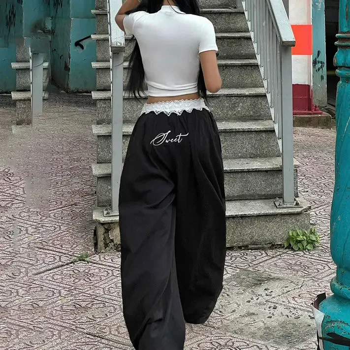 Pantaloni casual con ricamo in pizzo da strada Pantaloni a gamba larga da ragazza piccanti a vita bassa da donna