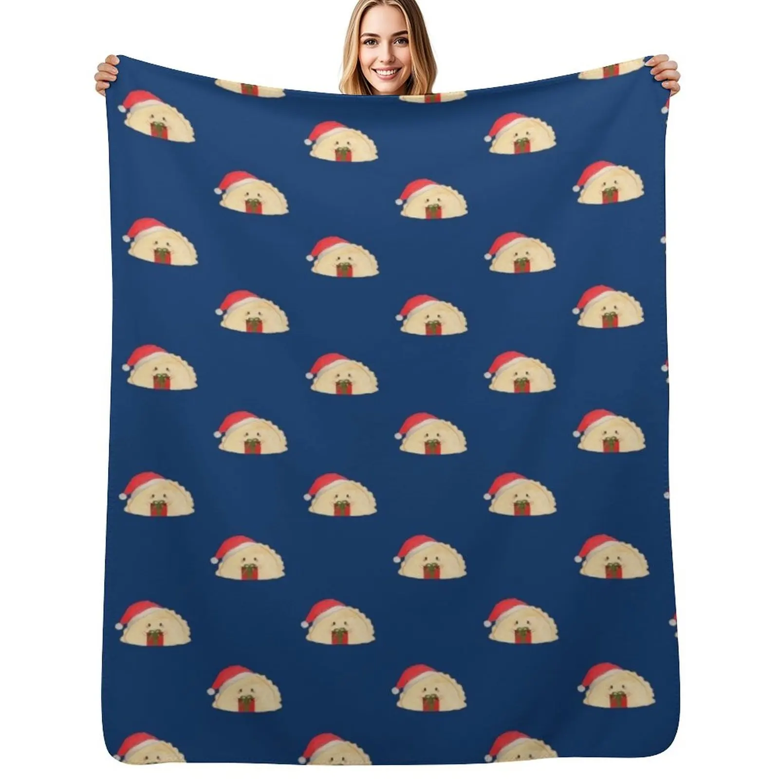 Adorable cute Christmas pierogi dumplings in Santa hat holding a present on navy background Throw Blanket Travel Blankets