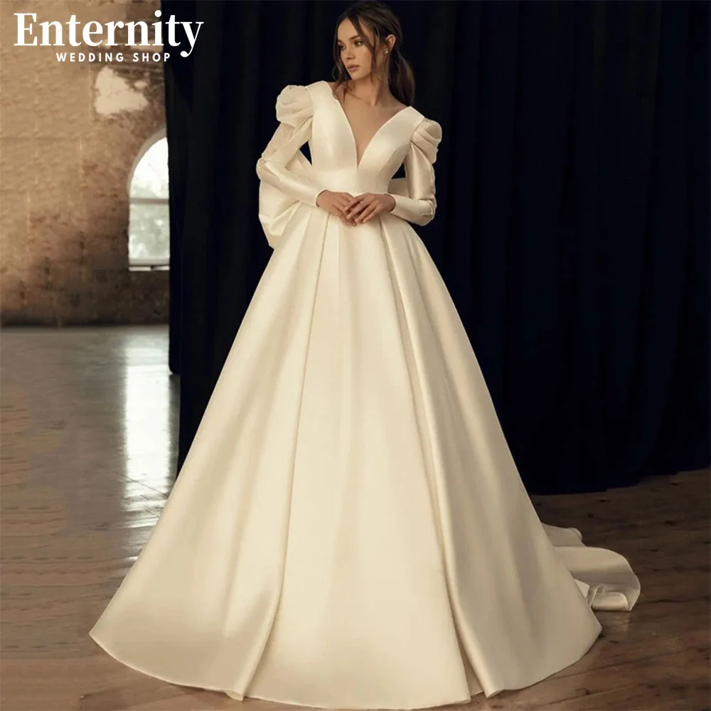 

Demure Deep V Neck A Line Wedding Dress Long Sleeves Open Back With Bow Bridal Gown Court Train Simple Vestidos De Novia