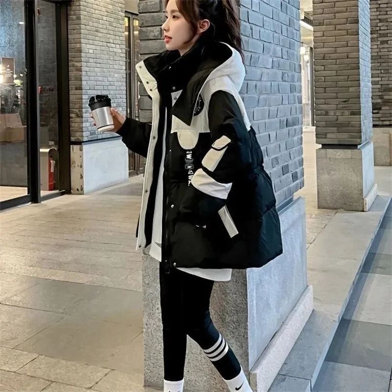 Chaqueta de algodón Parker negra de longitud media para mujer, nueva versión coreana 2026, abrigo con capucha de algodón suelto y empalmado, cálido para invierno.