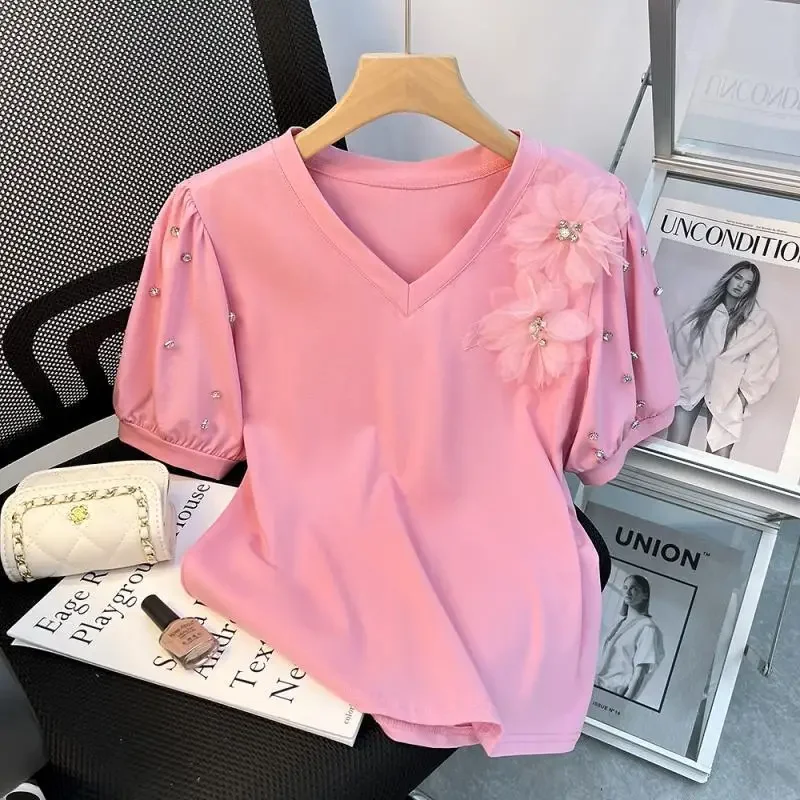 

Short-sleeved T-shirt female summer 2024 new fashion temperament design feeling slim temperament bubble sleeve beaded top.