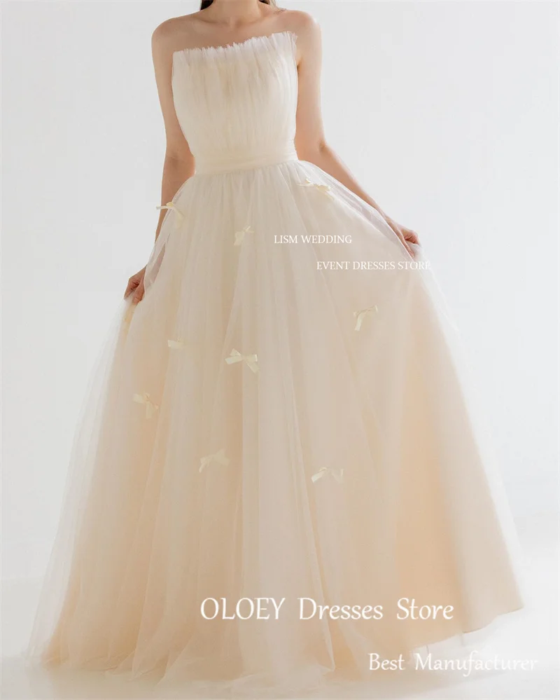 Oloey Fairy Tulle A line เดรสแต่งงานเกาหลีสำหรับถ่ายภาพชุดเกาะอกโบว์ผูกติดอยู่กับสวนชุดเจ้าสาวความยาวตั้งพื้นตามสั่ง