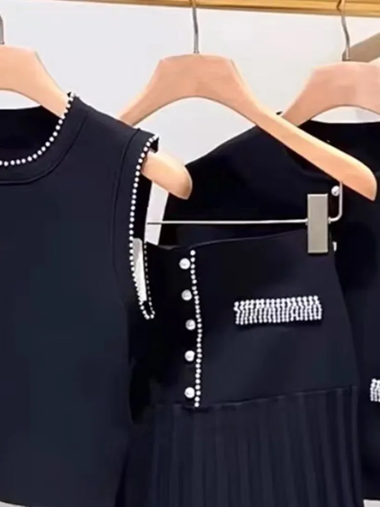 Conjunto de punto con adornos de perlas para mujer, minifalda plisada de cintura alta o cárdigan de manga larga con un solo pecho y cuello redondo, traje elegante para primavera 2024